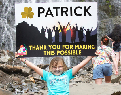 Girl with Thank You Patrick sign
