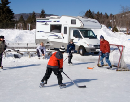 Family plays hockey near their RV_t