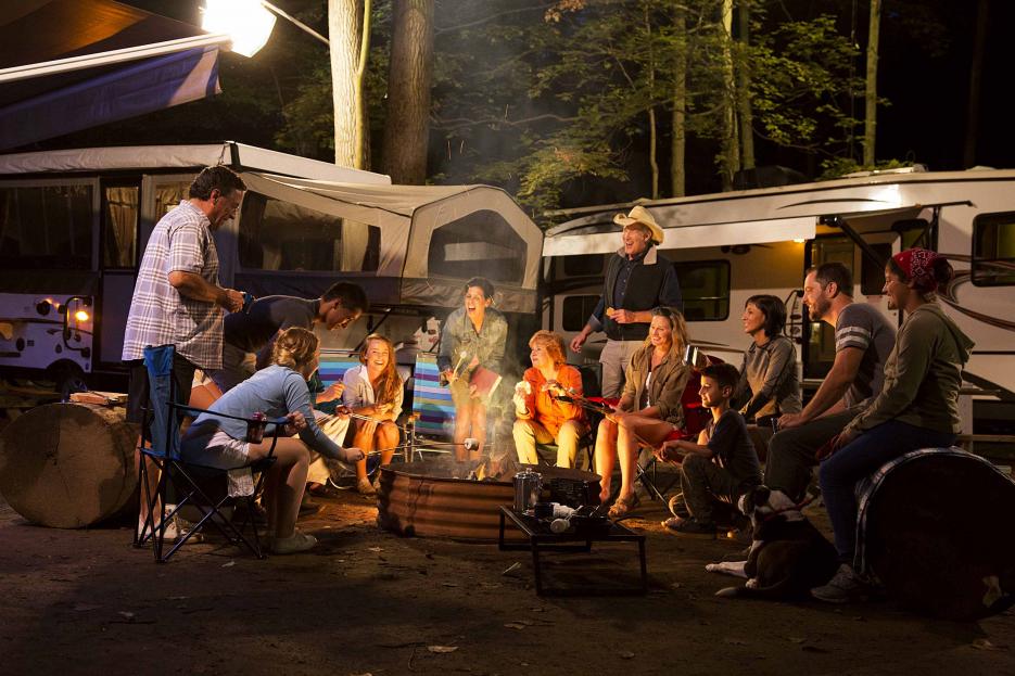 RVs and People around campfire RVs and People around campfire